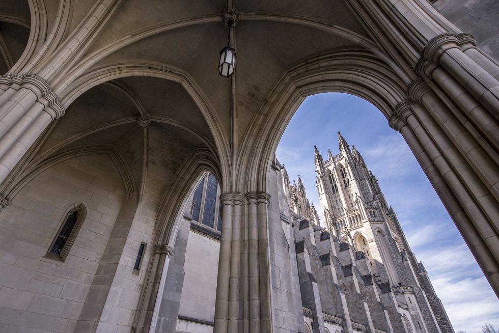 The Cathedral's west towers are seen through the north porch's limestone arches.